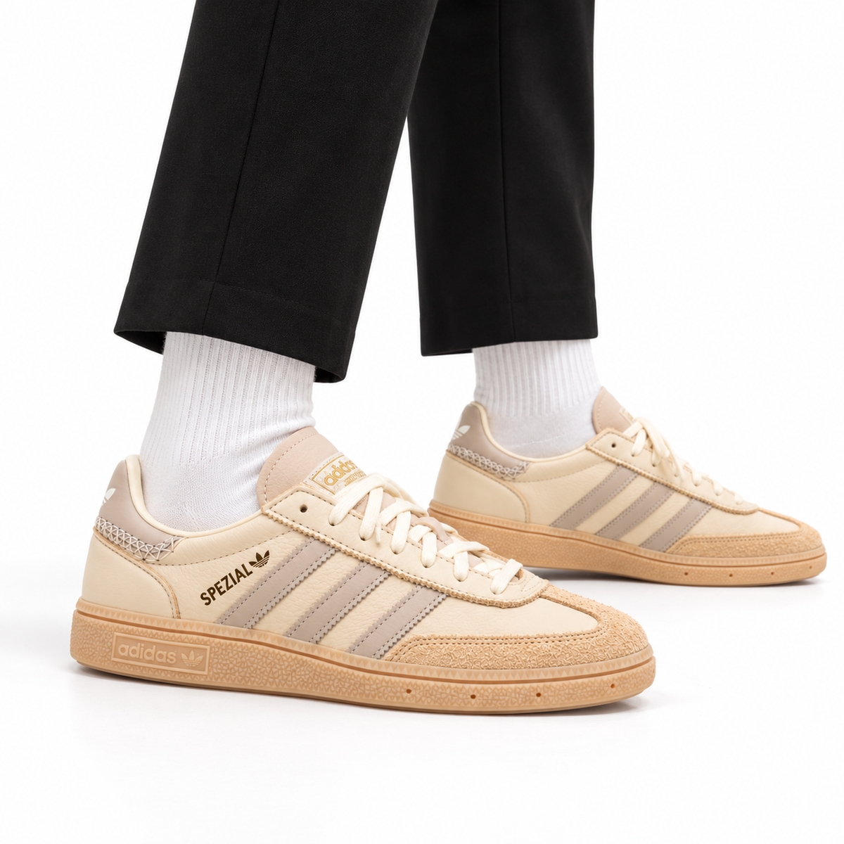 adidas Handball Spezial – Cream White Beige worn with cropped black tailored trousers and white crew socks, both shoes facing right