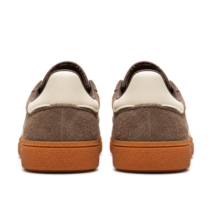 Straight rear view of brown adidas Handball Spezial shoes with plain cream heel tabs and warm gum soles.