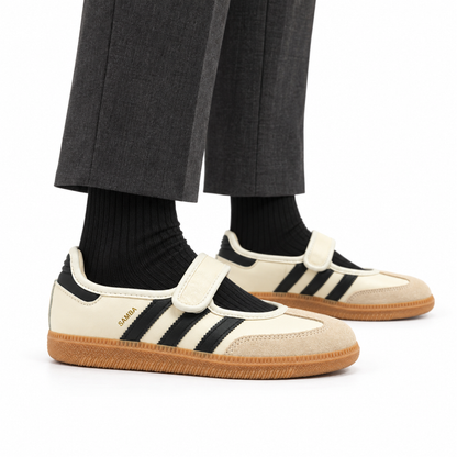 adidas Samba Jane Cream White worn with charcoal tailored trousers and black socks, both shoes facing right