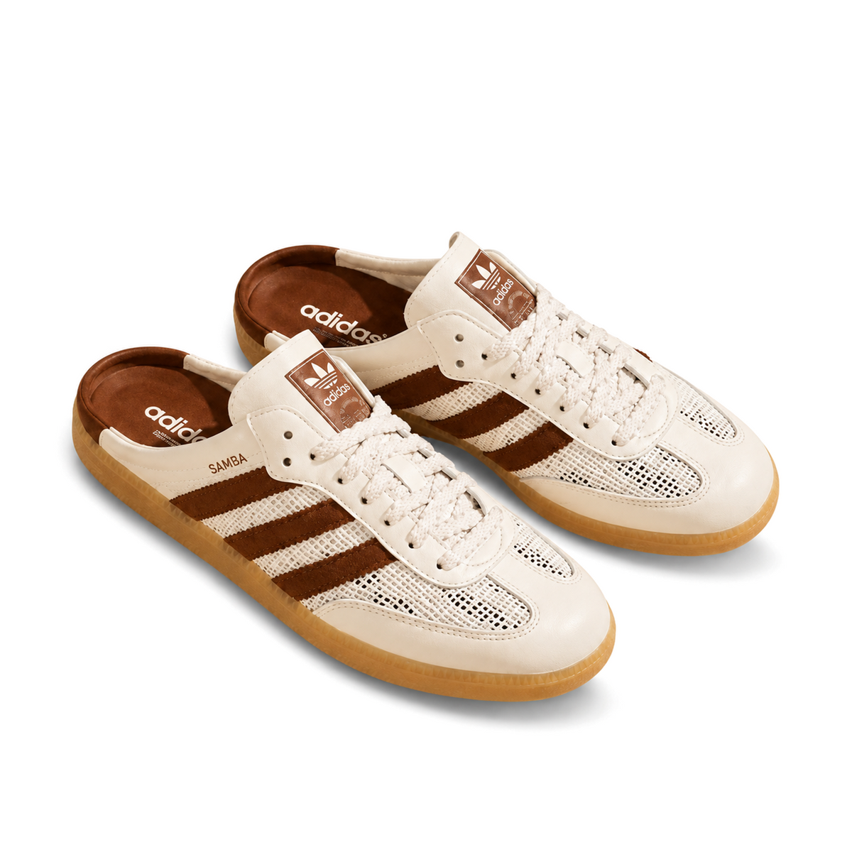 Front three-quarter view of a pair of off-white and brown Samba Mules with off-white laces and exposed brown footbeds.
