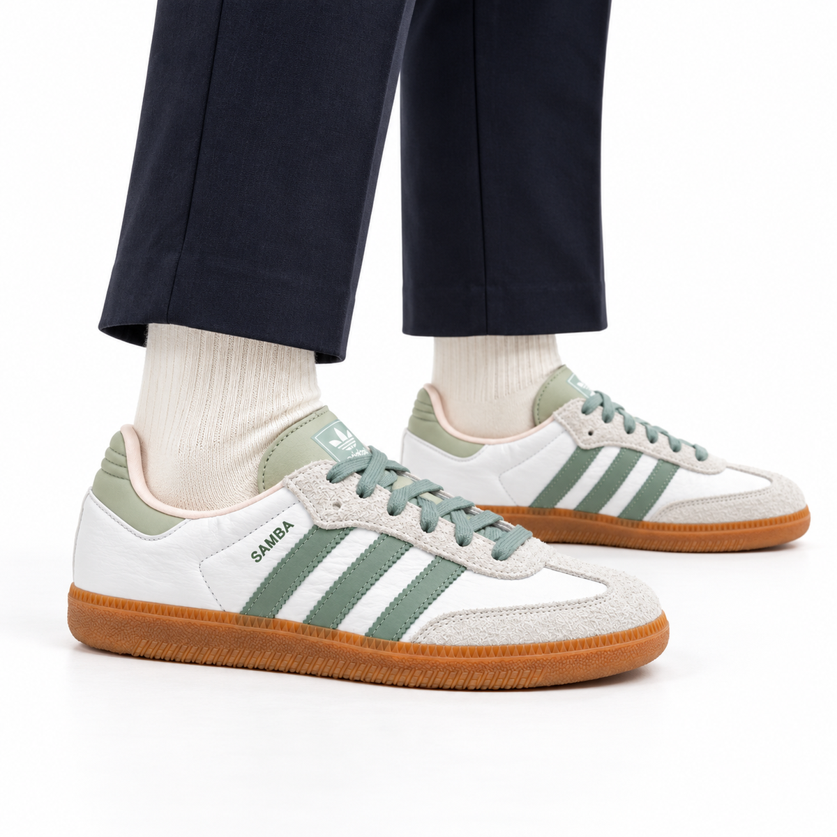 adidas Samba – Silver Green worn with navy cropped tailored trousers and cream socks, both shoes facing right