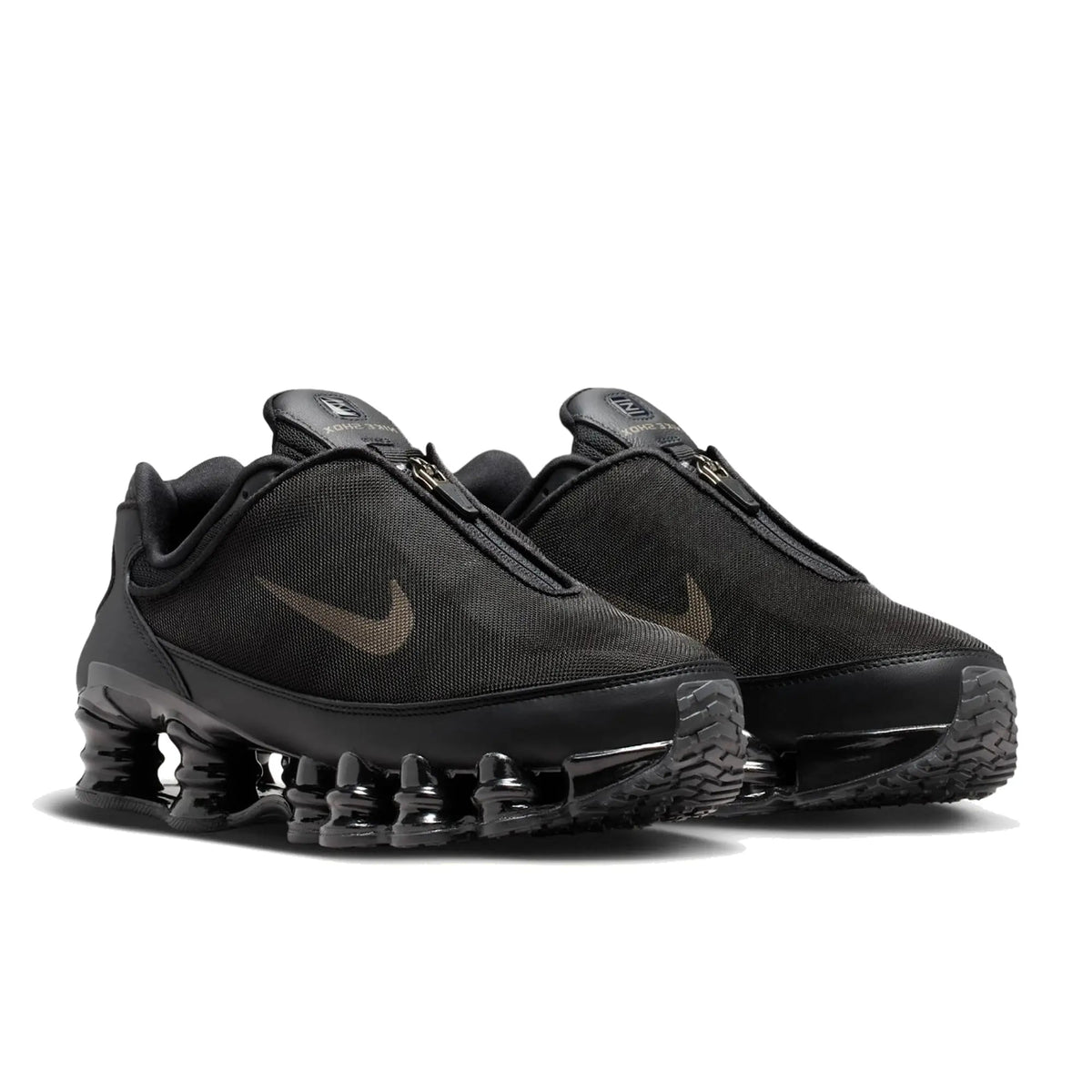 Pair of Nike Shox TL Winterized Black and Cave Stone unisex sneakers