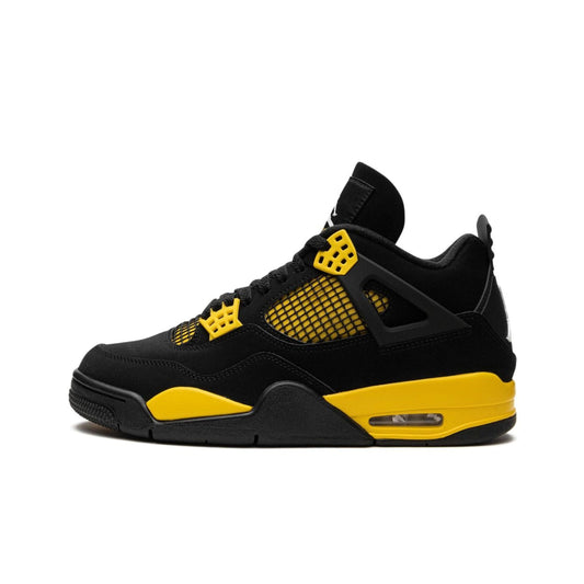 Nike Air Jordan 4 Retro 'Thunder' sneaker with black nubuck upper and yellow detailing on the eyelets and quarter panel.