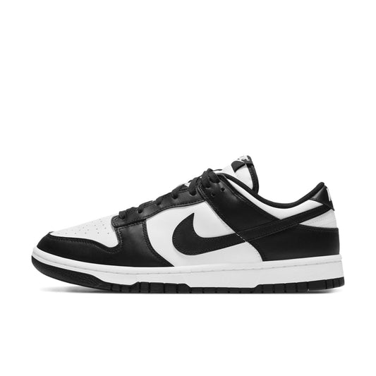 A Nike Dunk Low Next Nature shoe with white leather and black synthetic leather accents, featuring a black Swoosh logo, white midsole, and black outsole.