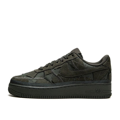 A pair of black Nike Air Force 1 Low sneakers with Billie Eilish branding on the side.
