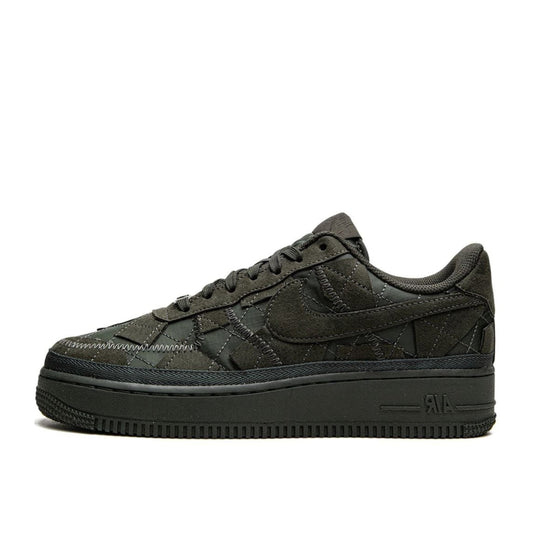 A pair of black Nike Air Force 1 Low sneakers with Billie Eilish branding on the side.