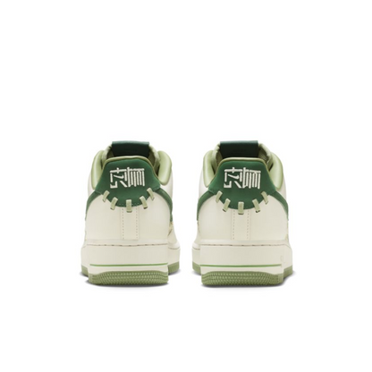 Nike Air Force 1 Low "NAI-KE" in a green woven.