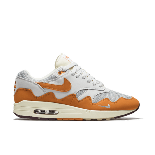 Nike Air Max 1 in Neutral Grey, Safety Orange, White, and Black.