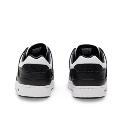 Lacoste Court Cage sneakers in white and black.